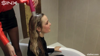 Blondes shampoo each other in a tub Screencap 29 on www.sinx.com