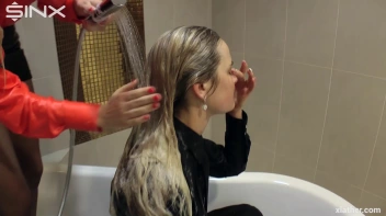 Blondes shampoo each other in a tub Screencap 43 on www.sinx.com