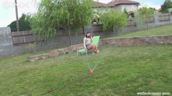 Brunette's Very Wet Sprinkler Frolic Screencap 16 on www.sinx.com