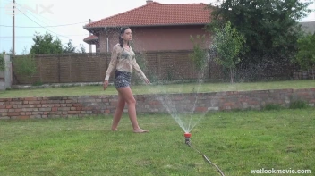Brunette's Very Wet Sprinkler Frolic Screencap 30 on www.sinx.com