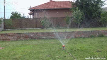 Brunette's Very Wet Sprinkler Frolic Screencap 33 on www.sinx.com