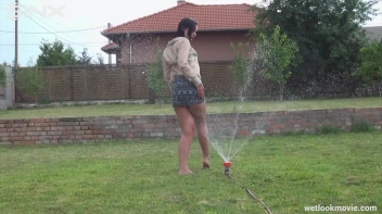 Brunette's Very Wet Sprinkler Frolic Screencap 38 on www.sinx.com