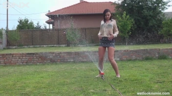 Brunette's Very Wet Sprinkler Frolic Screencap 45 on www.sinx.com