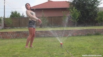 Brunette's Very Wet Sprinkler Frolic Screencap 49 on www.sinx.com