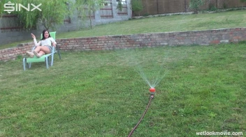 Brunette's Very Wet Sprinkler Frolic Screencap 7 on www.sinx.com