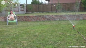 Brunette's Very Wet Sprinkler Frolic Screencap 10 on www.sinx.com