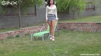 Brunette's Very Wet Sprinkler Frolic Screencap 11 on www.sinx.com